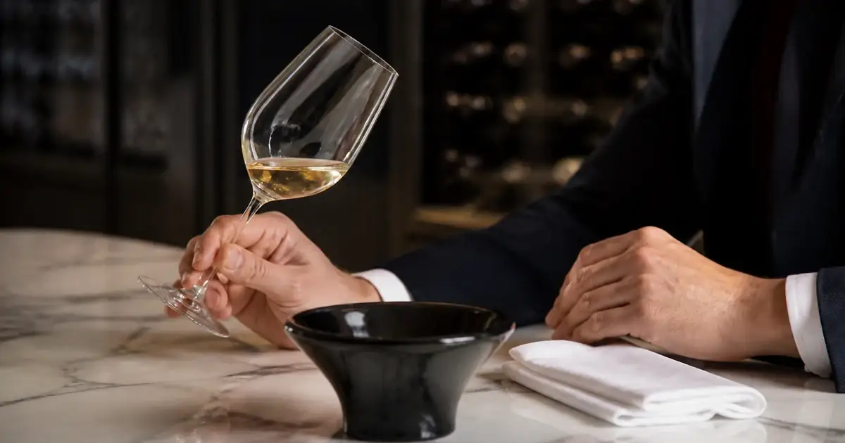 Tasting glass and white cloth on marble